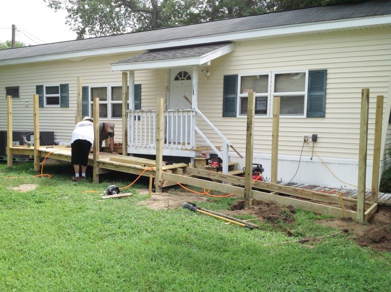 Photo of a wooden porch and wheelchair ramp being built